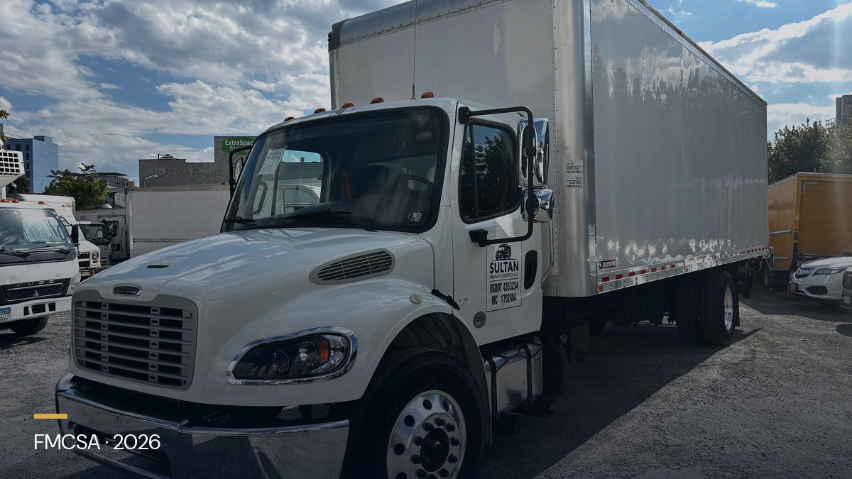 Box truck and freight paperwork representing broker payment and carrier protection