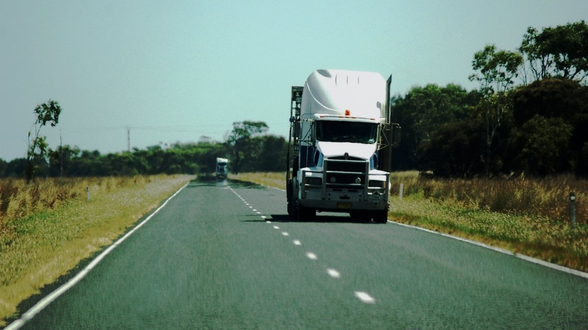 Semi truck on a Northeast highway illustrating rising diesel prices and the NJ/NY fuel surcharge in 2026