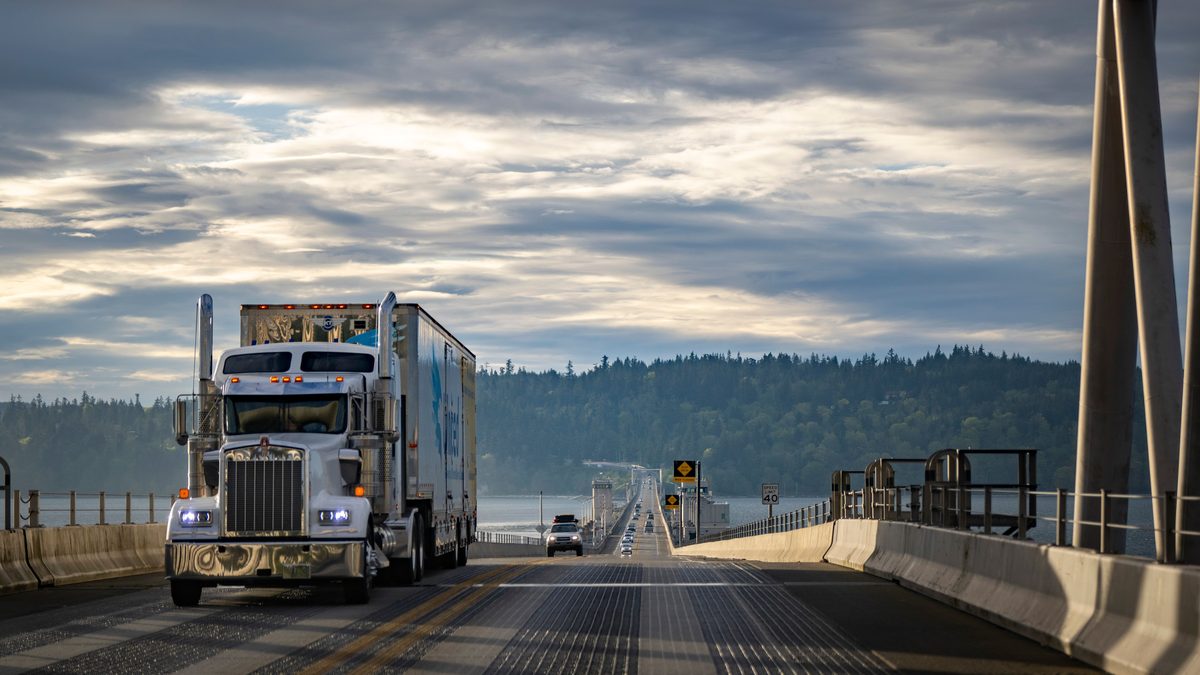Semi truck on a highway bridge — fuel surcharge record per mile 2026