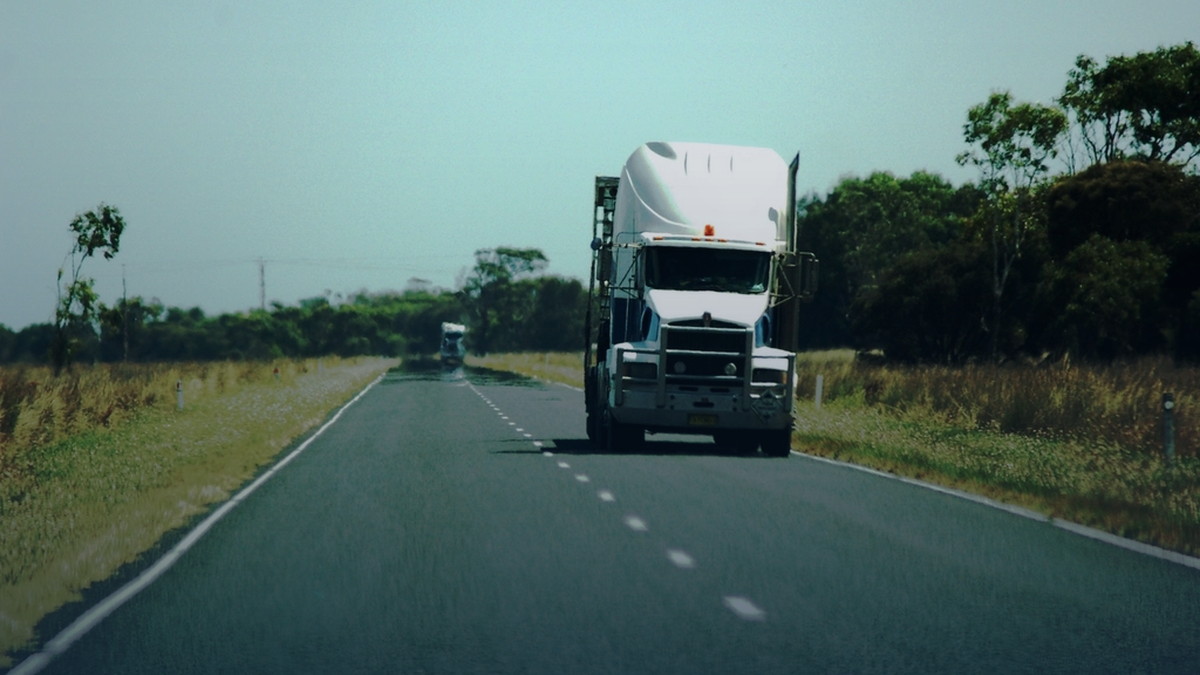 White semi on an open highway illustrating the July 20 2026 revoked ELD out-of-service enforcement deadline